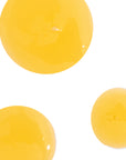 Three yellow spherical objects on a white background