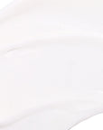 Close-up of a white ceramic plate with a subtle pattern on a white background