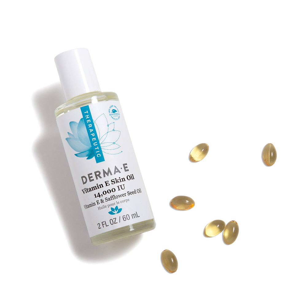 bottle of Vitamin E Oil for Skin with vitamin E capsules