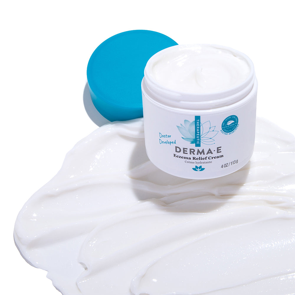 Jar of Eczema Relief Cream with texture smear