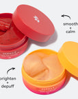 Two open jars of DERMA-E hydro gel patches: red jar labeled smooth + calm with hibiscus patches, and orange jar labeled brighten + depuff with Vitamin C patches.