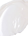 Close-up of a white, creamy smear of the Ultra Hydrating product, showcasing its rich and smooth texture.