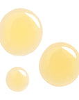 Close-up view of the yellow oil texture of Derma E Anti-Wrinkle Treatment Oil.