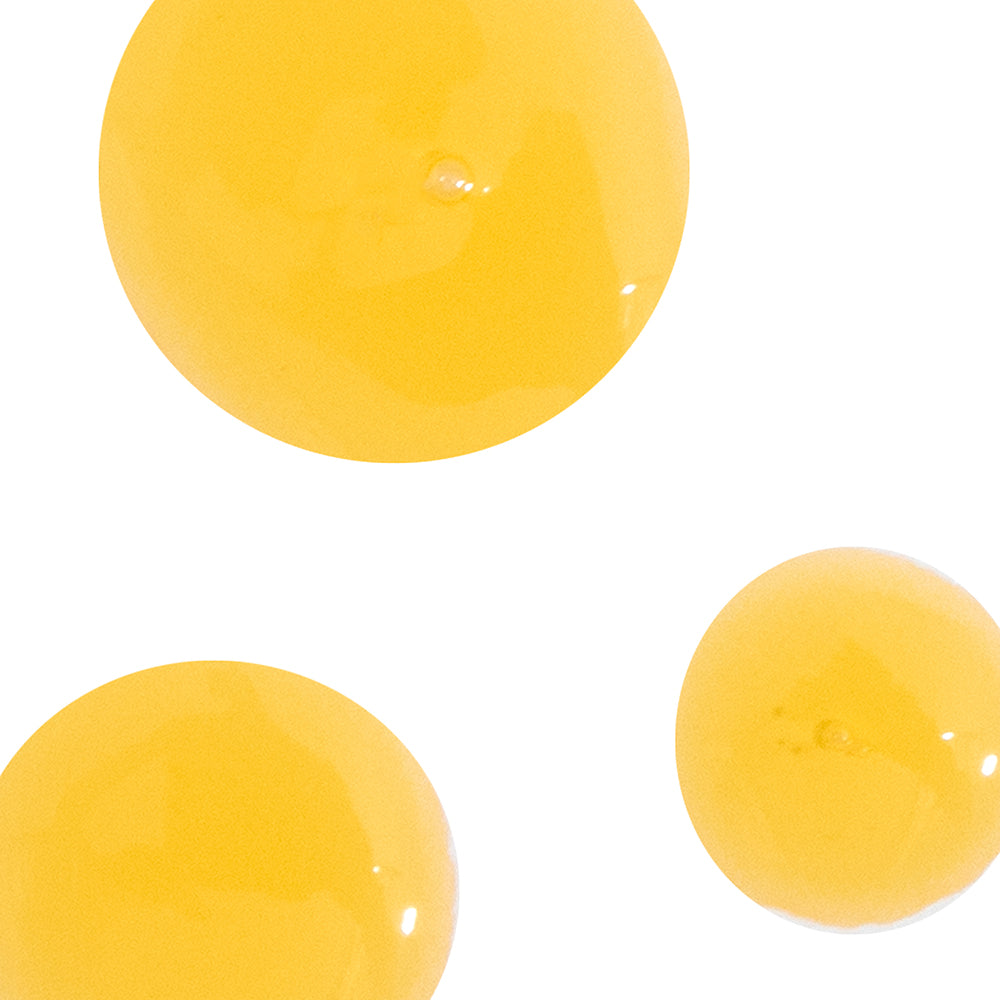 Three yellow spherical objects on a white background