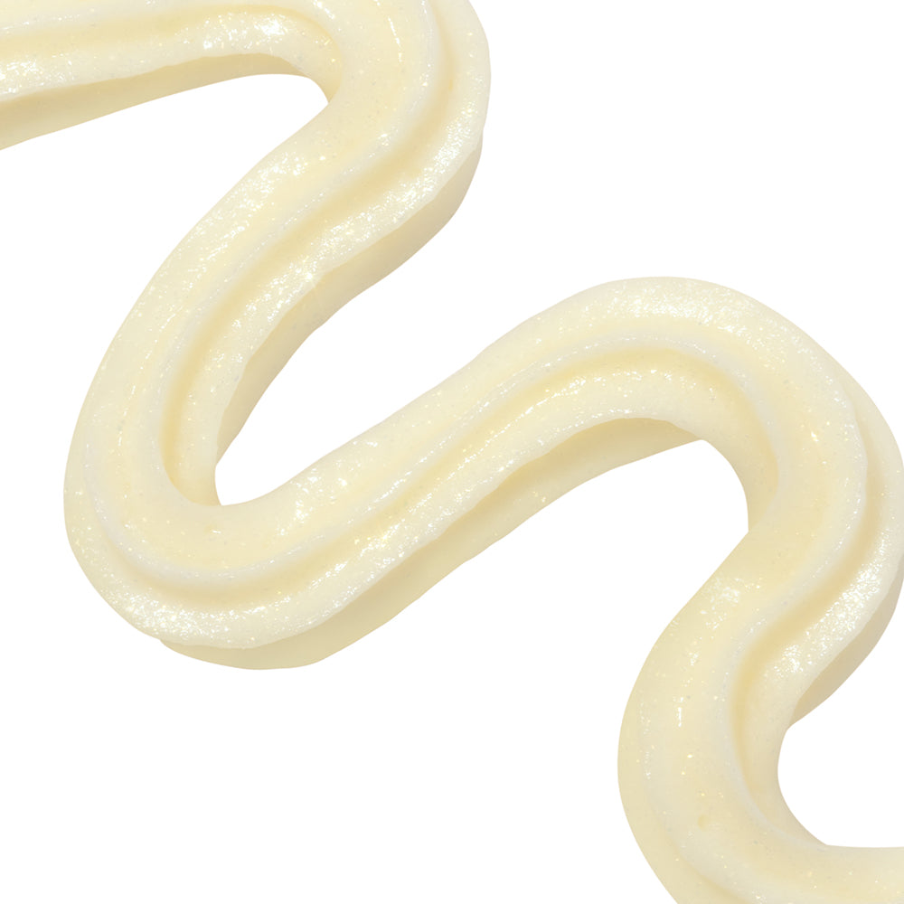 Close-up of smooth, white cream on a white background