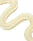 Close-up of smooth, white cream on a white background
