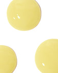 Three yellow circular objects on a white background