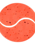 Red tennis ball with white lines on a white background