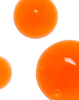 Three orange round objects on a white background