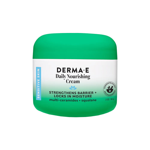 A green and white jar of DERMA-E Daily Nourishing Cream on a solid white background.