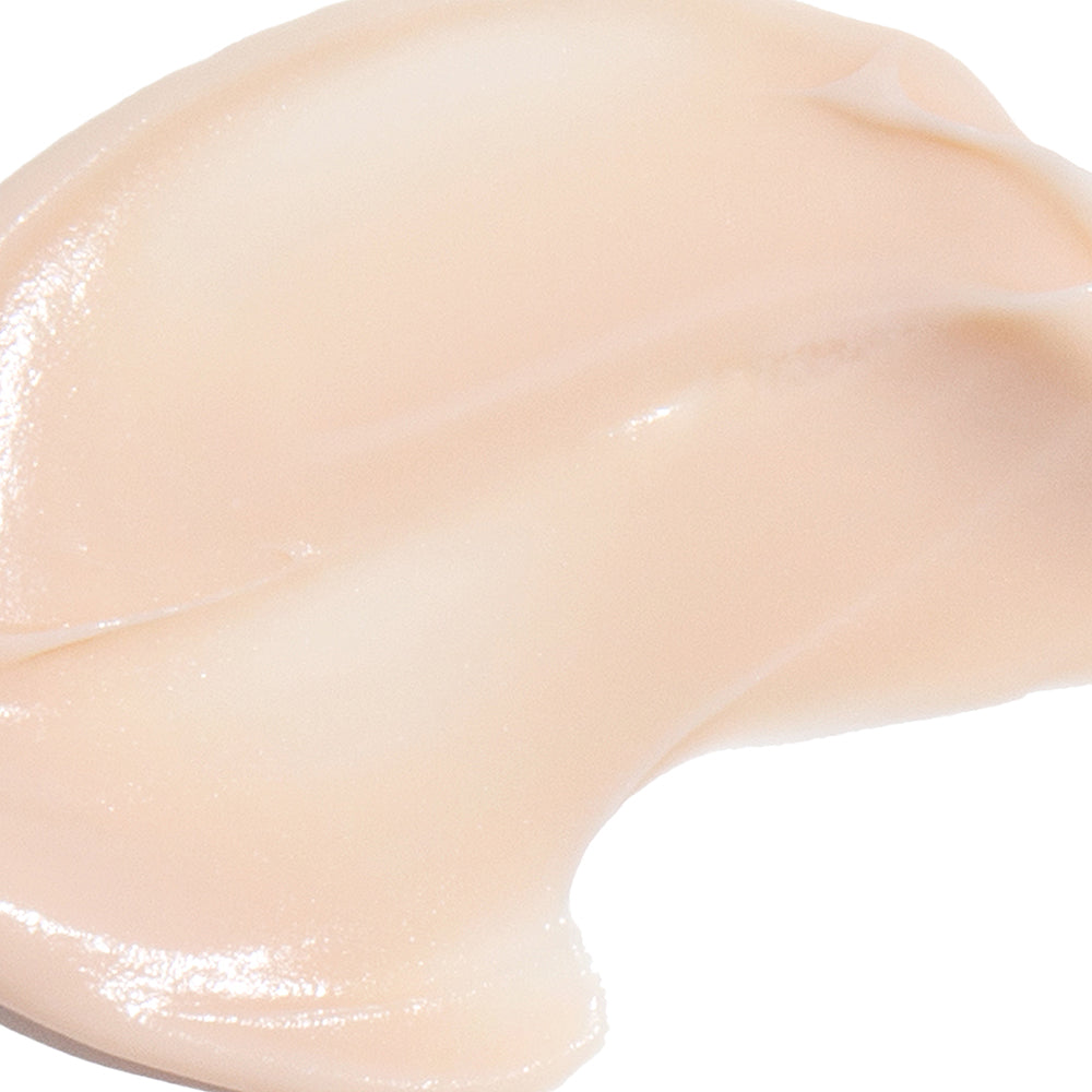 Close-up of a beige-colored cosmetic cream on a white background