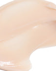 Close-up of a beige-colored cosmetic cream on a white background