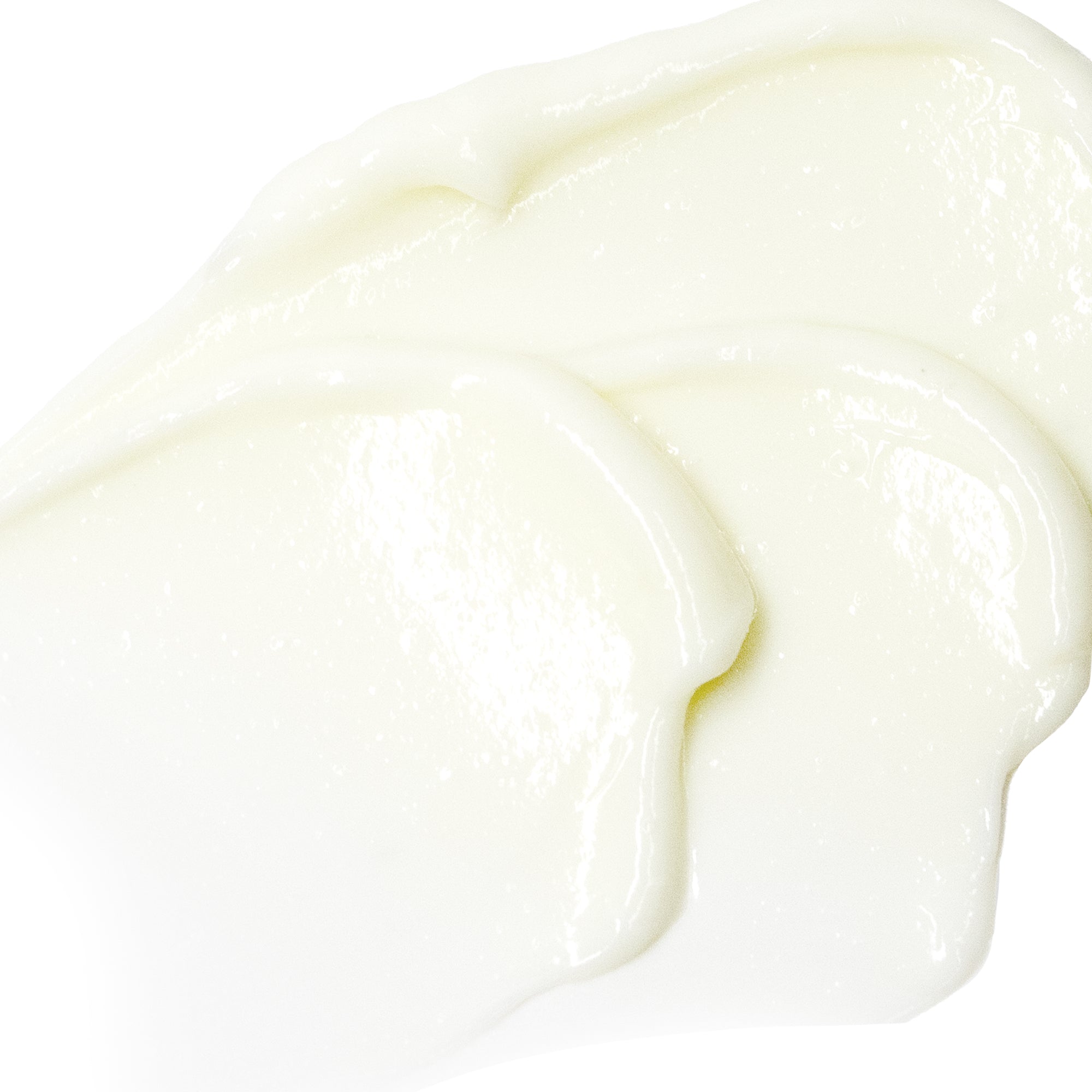 Close-up of smooth, white cream on a white background