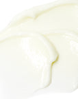 Close-up of smooth, white cream on a white background