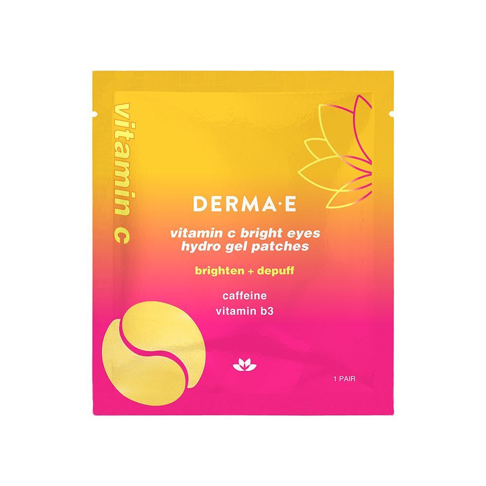 Packaging for Vitamin C Bright Eyes Hydro Gel Patches by Derma-E with vibrant yellow and pink colors, featuring the product's benefits such as brightening, caffeine, and vitamin B3.