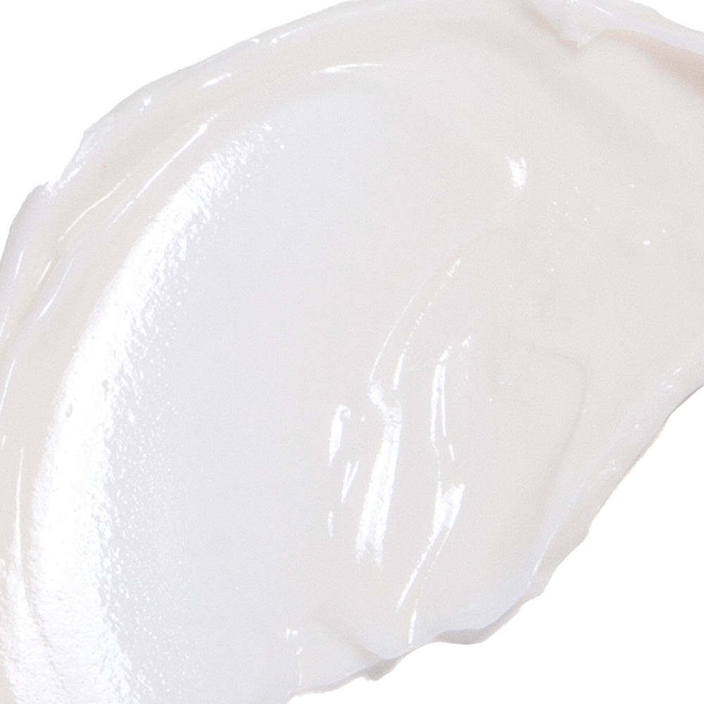 Close-up of a white, creamy smear of the Ultra Hydrating product, showcasing its rich and smooth texture.