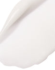 Close-up of a white ceramic plate with a subtle texture on a white background