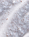 Close-up of the Purifying Daily Detox Scrub, showing the texture with fine exfoliating particles