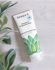Flat lay of DERMA E Fragrance-Free Vitamin E Body Lotion with ingredients such as Aloe Vera, Chamomile, and Shea Butter